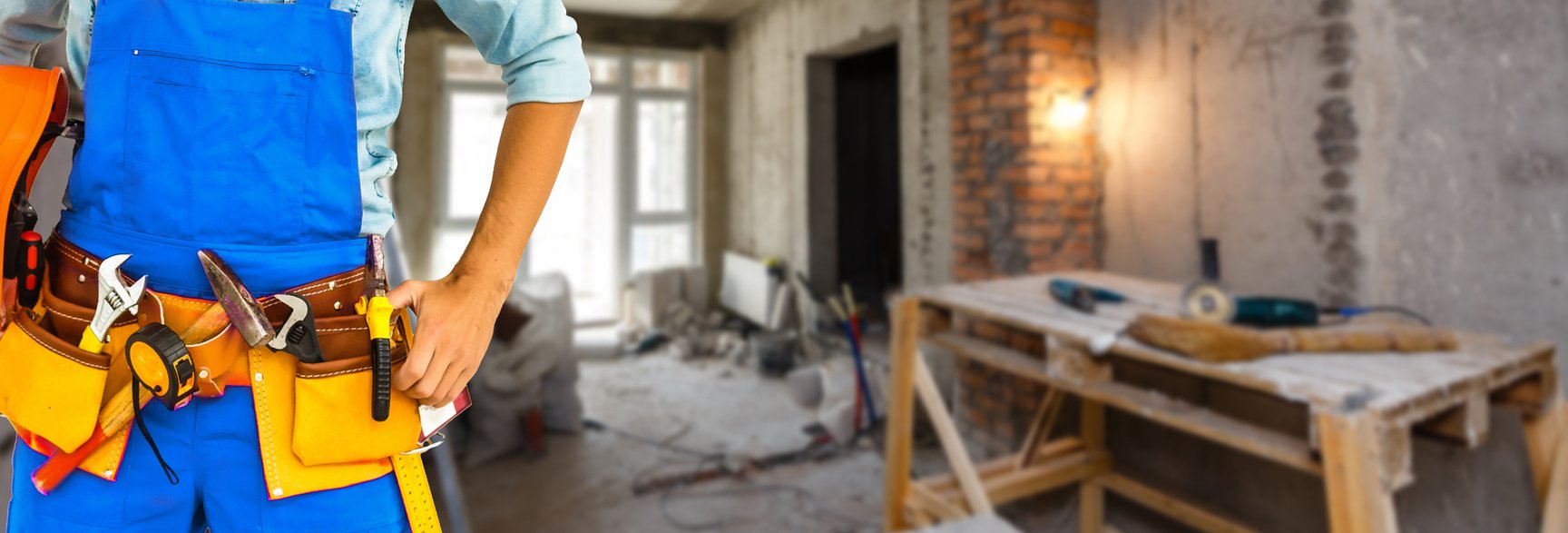 Builder handyman with construction tools.